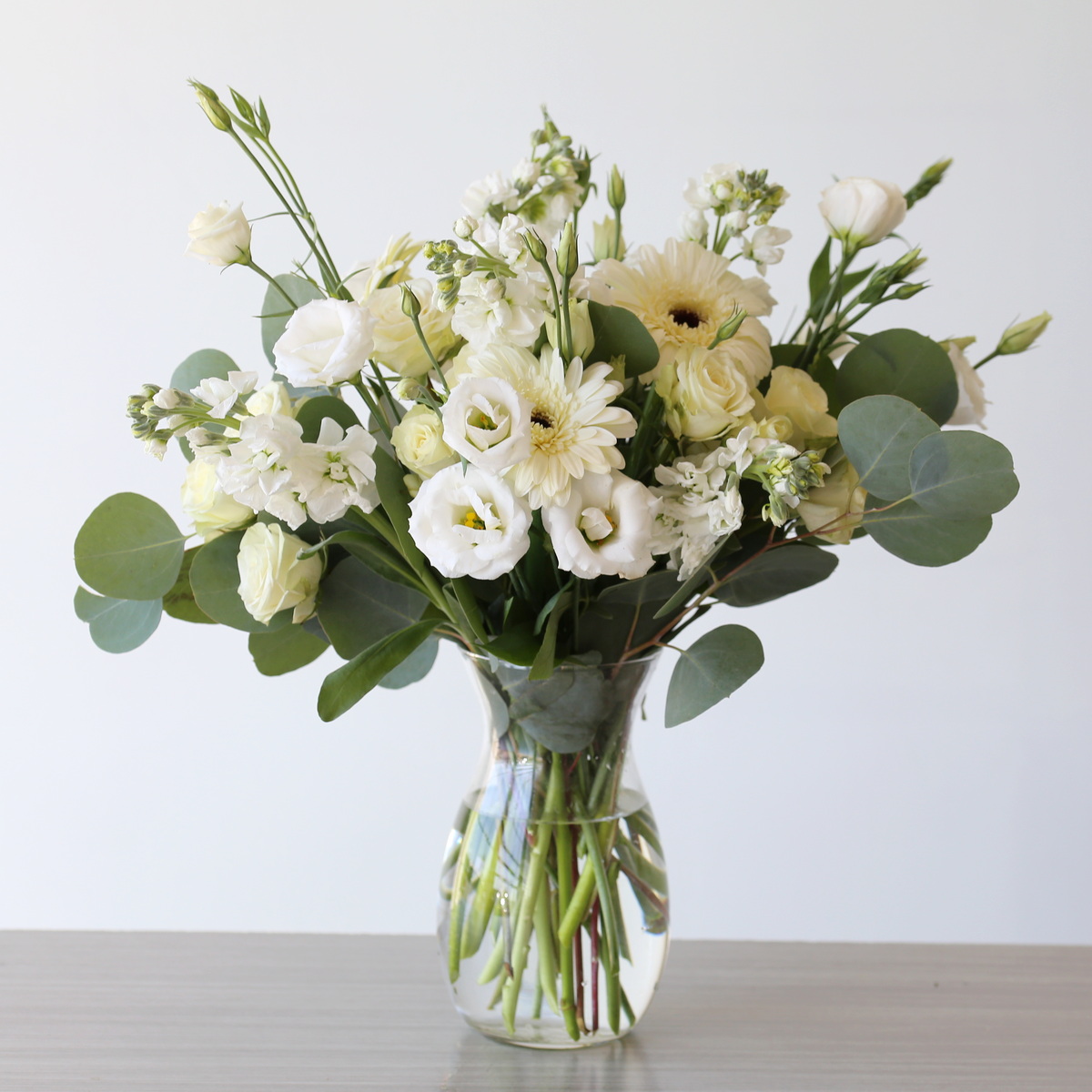 white bulk flower arrangement example using DIY floral bundle 2 vases centerpiece ideas