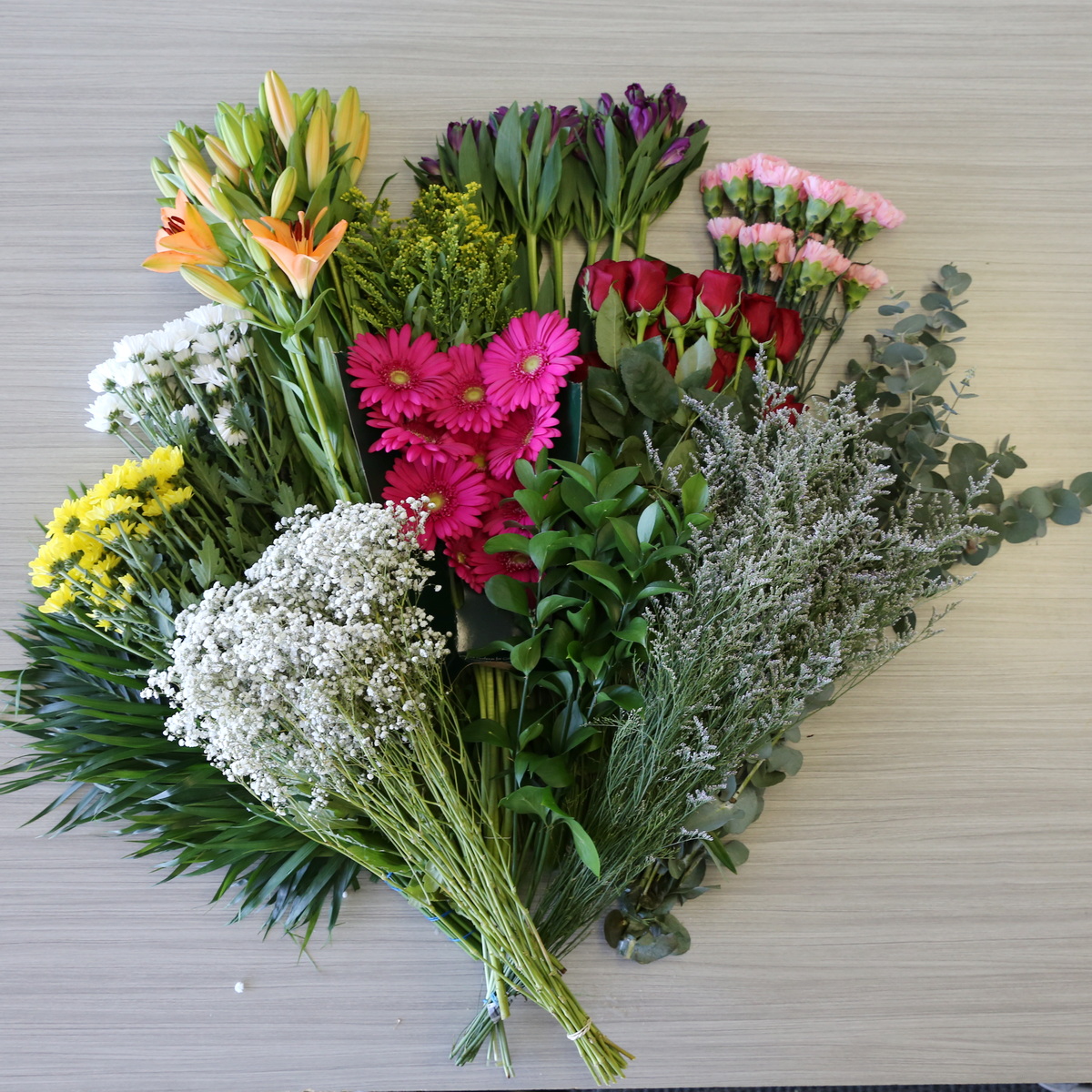 DIY bulk flower bundle with 12 varieties including roses lilies gerbera daisies greenery and filler flowers
